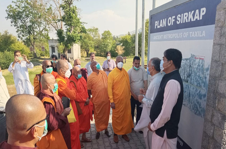 Sri Lankan Buddhist monks visit an archaeological site Sirkap in Taxila