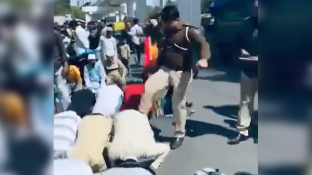 Watch: Indian cop kicks Muslims offering prayers