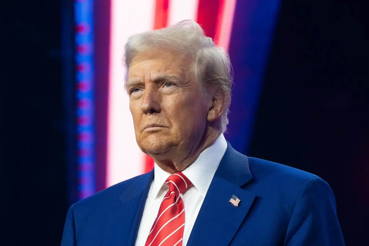 Donald Trump releasing coin with his face
