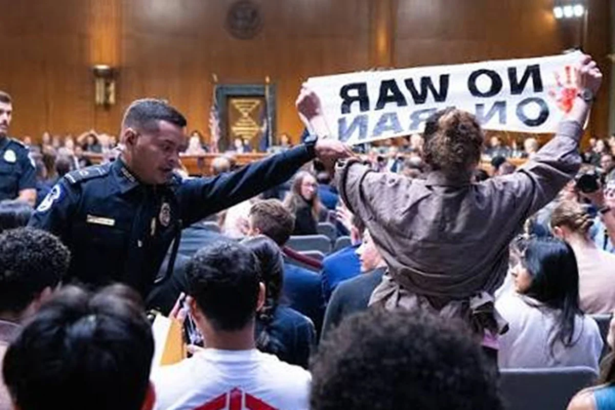 “Stop Bombing Iran and Palestine”: Protesters Disrupt Hegseth’s Senate Appearance